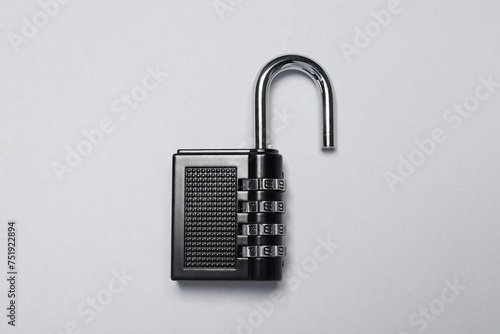 One steel combination padlock on grey background, top view