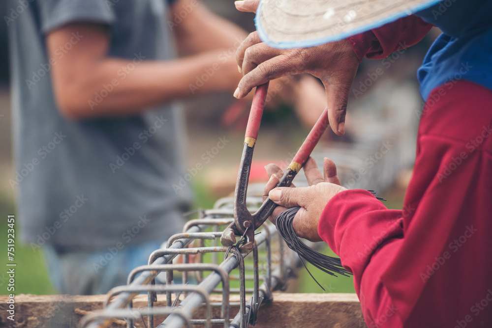 Construction Men hands bending cutting steel wire fences bar ...