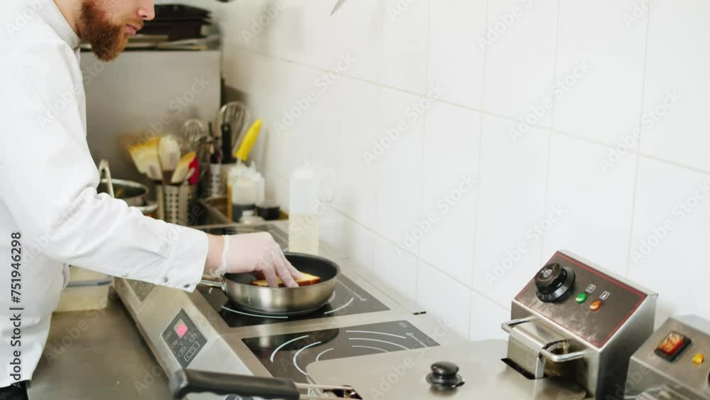 Chef making a brioche dessert at the professional kitchen close-up. Frying piece of bread.Man cooking an order at the restaurant cafe bar Chef making a brioche dessert at the professional kitchen close-up. Frying piece of bread.Man cooking an order at the restaurant cafe bar