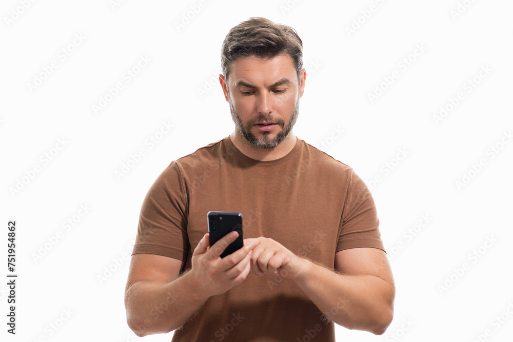 Handsome business man talking on phone. Businessman in casual clothes using smart phone isolated over studio background. Portrait of cheerful guy using cell phone, browse social media on phone.