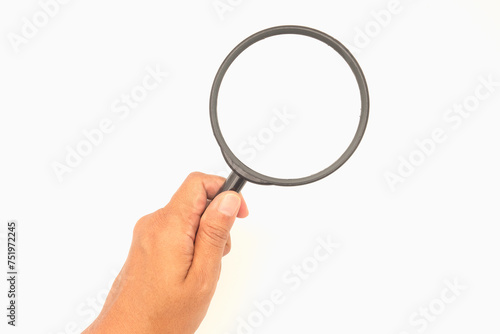 Close-up of hand holding a magnifier on a white background.