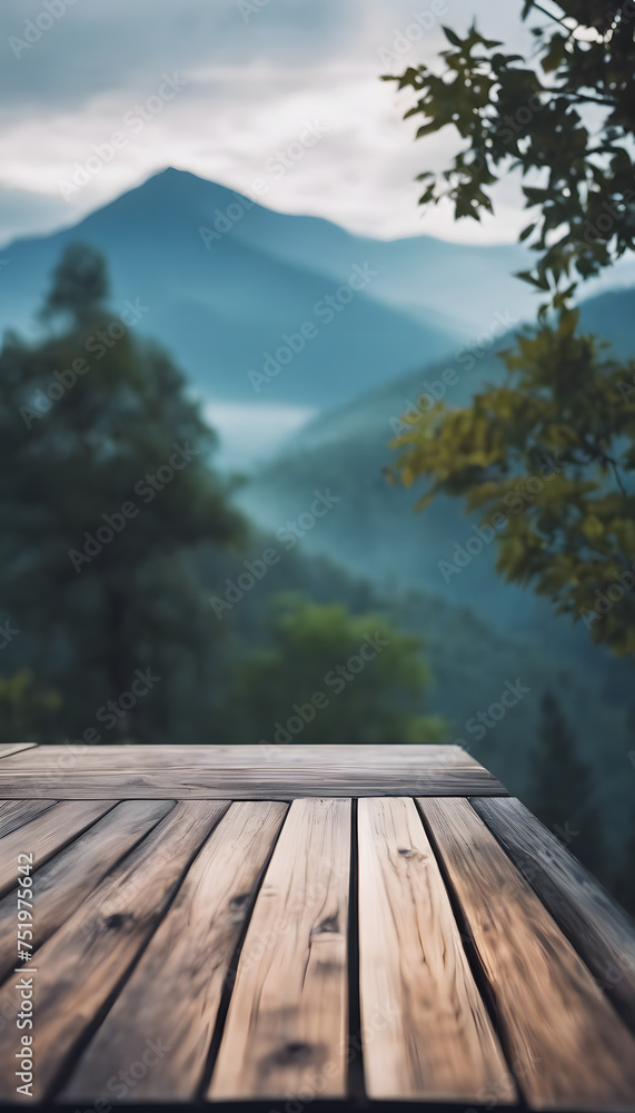 Wooden platform with a scenic view of misty mountains and forest in the background. Wooden platform with a scenic view of misty mountains and forest in the background.