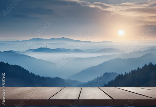 Misty mountain sunrise with wooden platform foreground.