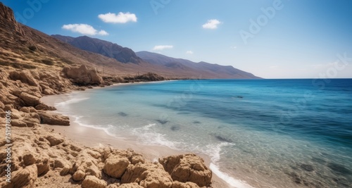  Tranquil beach cove with clear blue waters and rocky cliffs © vivekFx