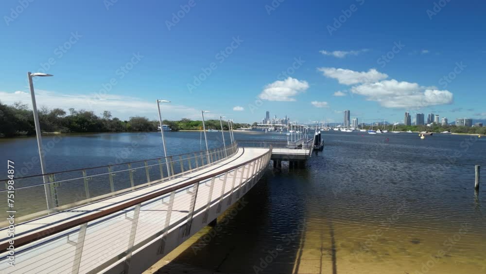 Creative view of a Modern style recreational boating and fishing pontoon located in a safe anchorage harbor. Gold Coast Australia Creative view of a Modern style recreational boating and fishing pontoon located in a safe anchorage harbor. Gold Coast Australia