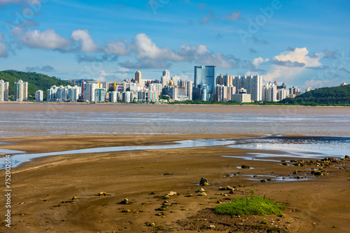 Skyline of northern Taipa, Macau, from southern Macau at low tide. photo