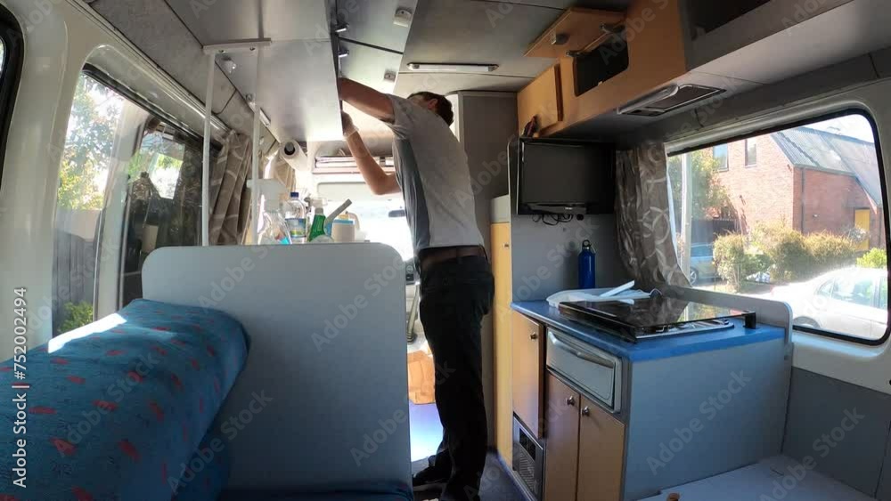 Timelapse of married couple cleaning a campervan before going on holiday. Timelapse of married couple cleaning a campervan before going on holiday.