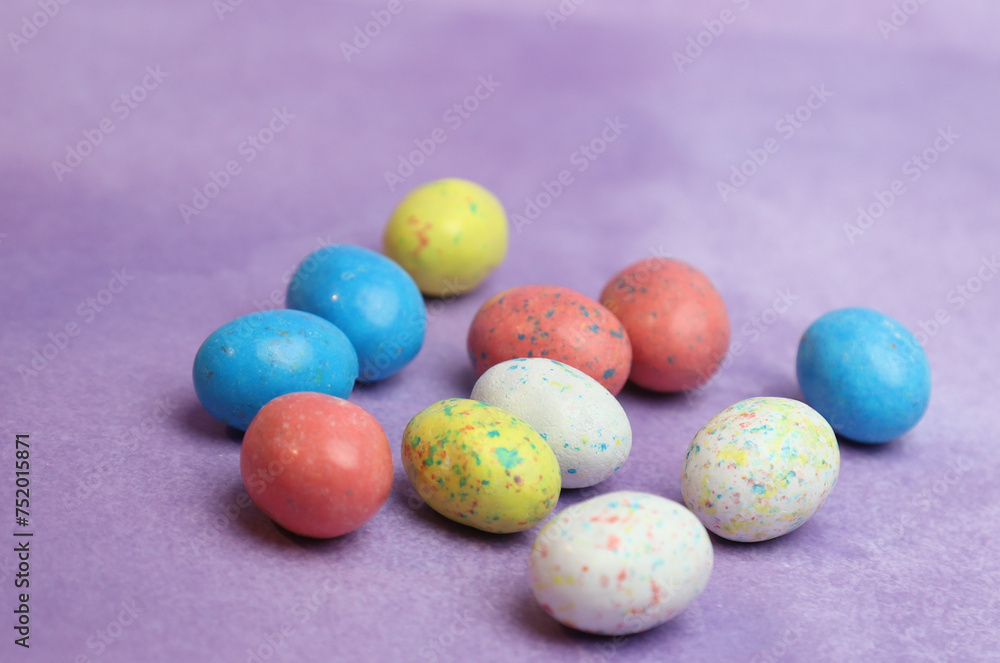 Spotted eggs on purple background Spotted eggs on purple background