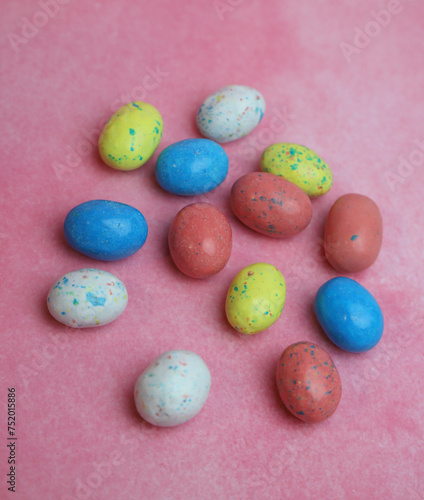 Spotted eggs on pink background 