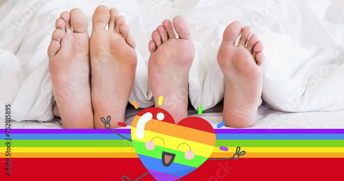 Image of rainbow flag over feet of gay couple