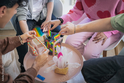 Midsection of LGBTQIA friends discussing in clinic