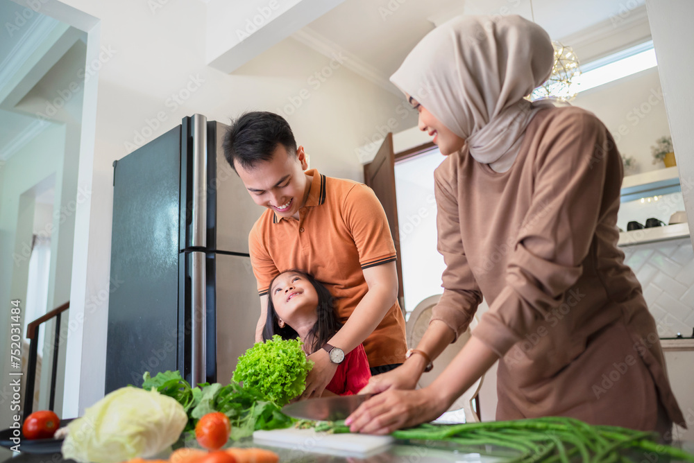 Portrait of a Muslim family preparing food Portrait of a Muslim family preparing food