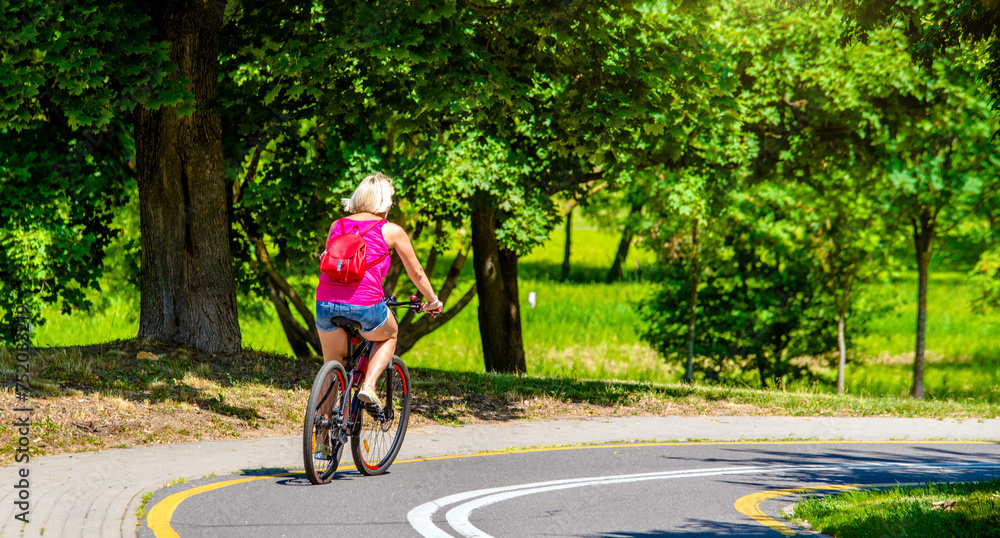 Cyclist ride on the bike path in the city Park
Cyclist ride on the bike path in the city Park
