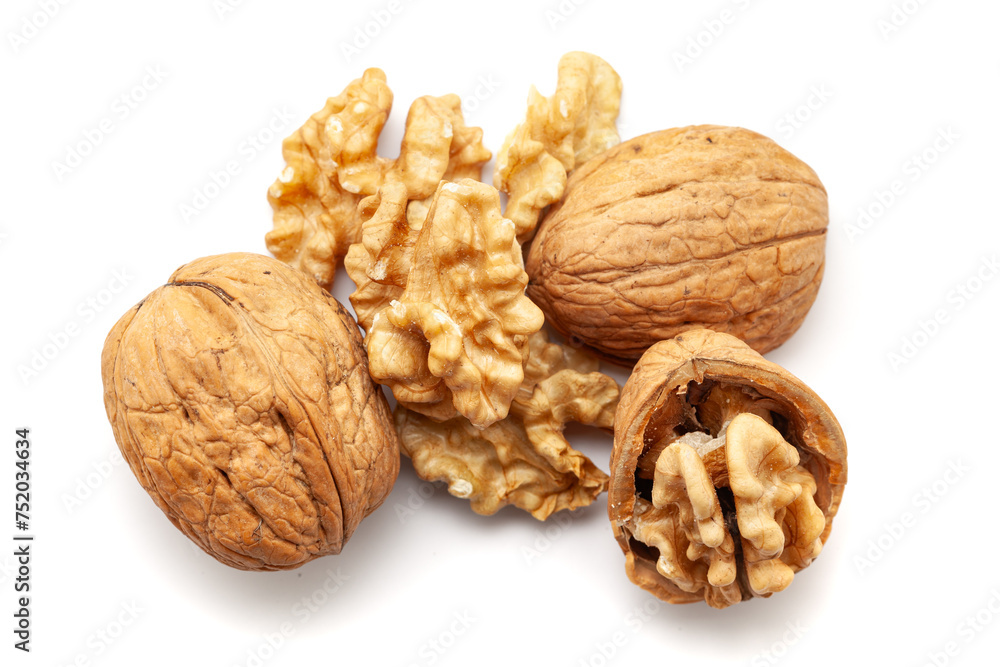 Top view of Organic cracked Walnuts (Juglans regia), isolated on a white background. Top view of Organic cracked Walnuts (Juglans regia), isolated on a white background.
