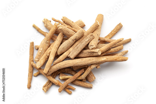 A pile of Dry Organic Ashwagandha (Withania somnifera) roots, isolated on a white background. Top view