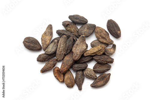 A pile of Dry Organic Myrobalan or Harad (Terminalia chebula), isolated on a white background. Top view