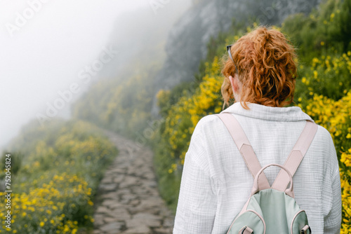 Hikers along summit trail to Pico Ruivo on Madeira Island in Portugal photo