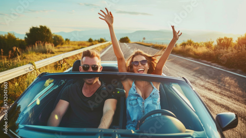 Happy couple driving convertible car on the road, Boyfriend and girlfriend with arms up having fun