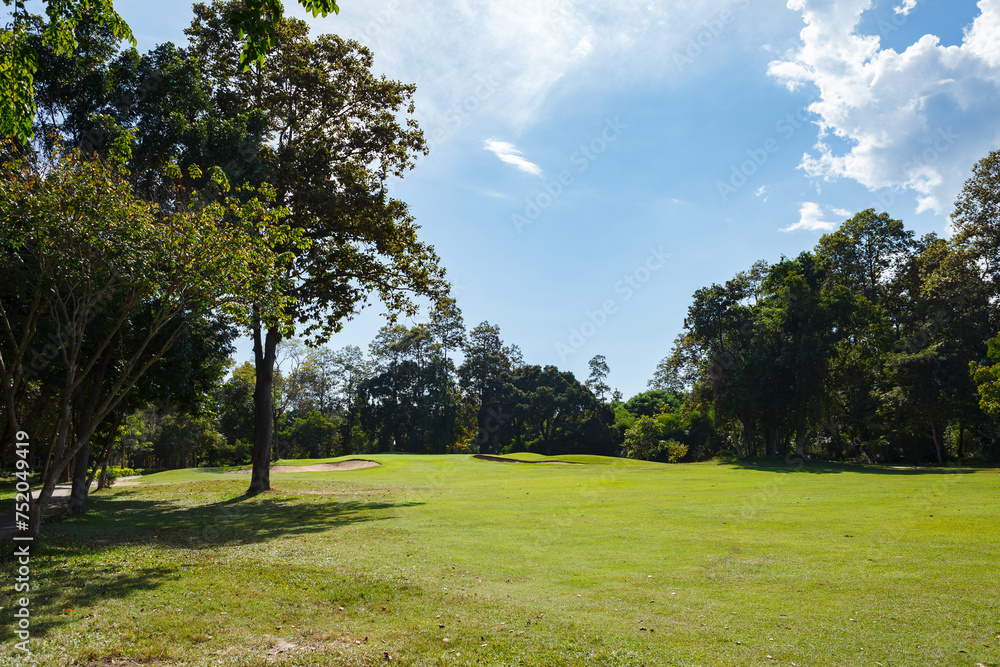 Golf course with blue sky background Golf course with blue sky background