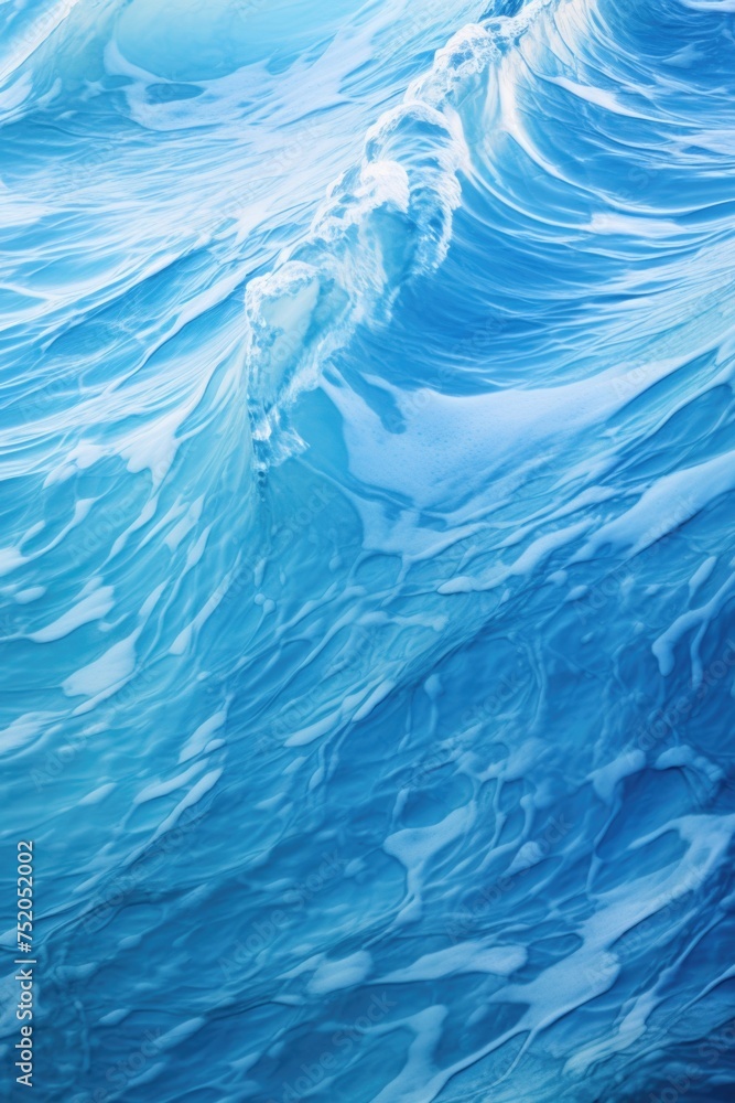 A powerful blue wave in the vast ocean, suitable for various water-related themes