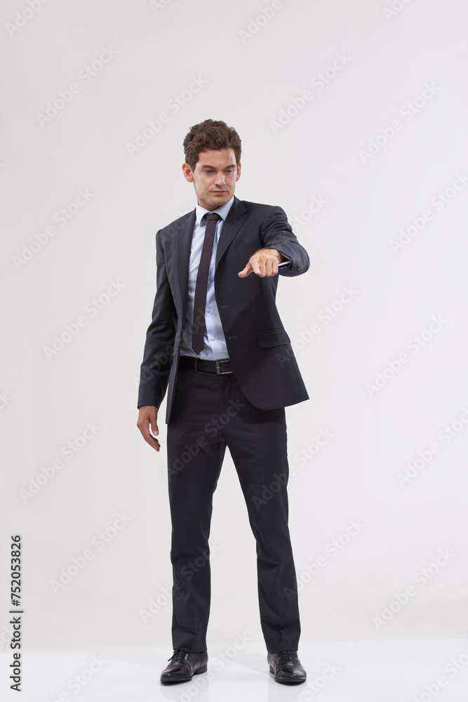 Businessman, studio and pointing with interface for touch, UX or UI on a gray background. Full body of young man, user or employee with interaction for virtual technology, push or click on mockup Businessman, studio and pointing with interface for touch, UX or UI on a gray background. Full body of young man, user or employee with interaction for virtual technology, push or click on mockup