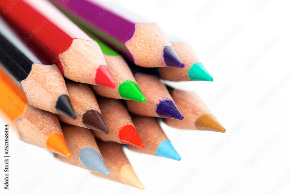 close up of colored pencils isolated on white close up of colored pencils isolated on white