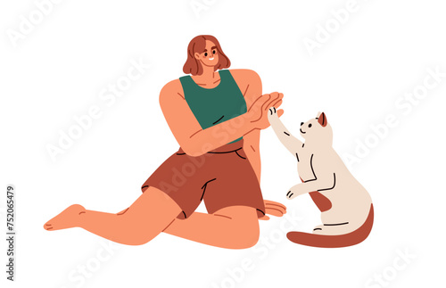 Cute cat and woman giving high five. Smart obedient trained feline animal and...