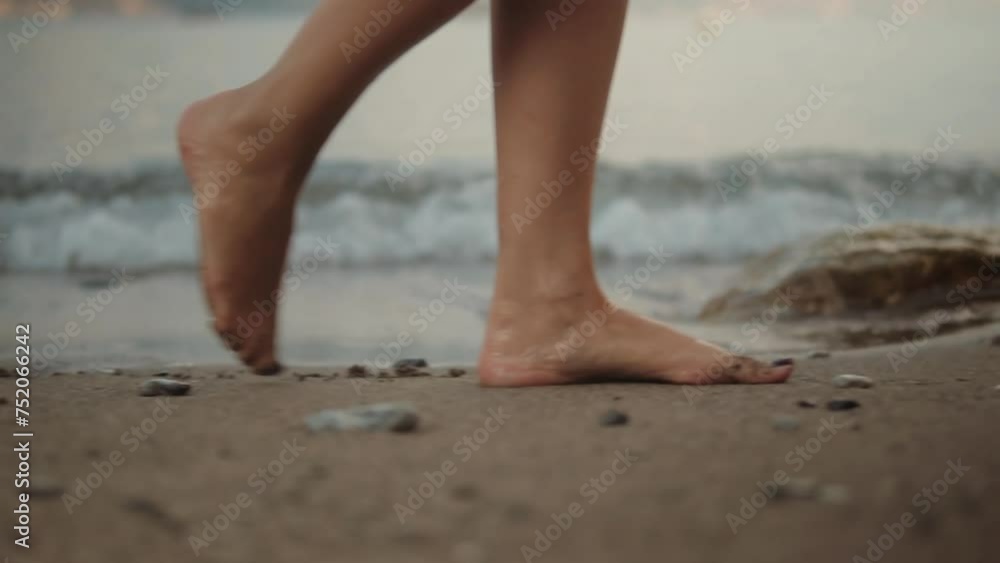 Legs of girl stepping and relaxing on sandy coast Legs of girl stepping and relaxing on sandy coast