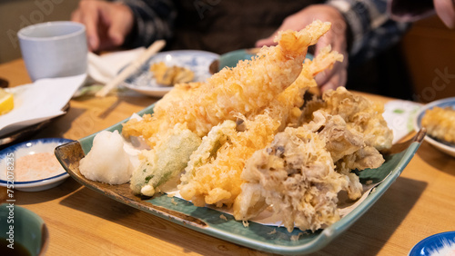 Deep fried kaki oyster tempura served with salt and lemon photo