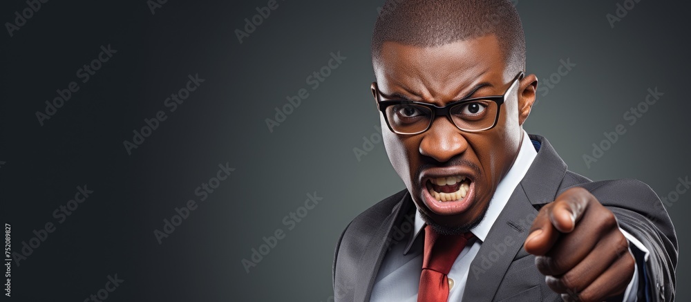 Furious African American Businessman Pointing Intensely at the Camera - obrazy, fototapety, plakaty 