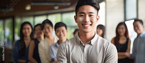 Smiling Asian man in front ...