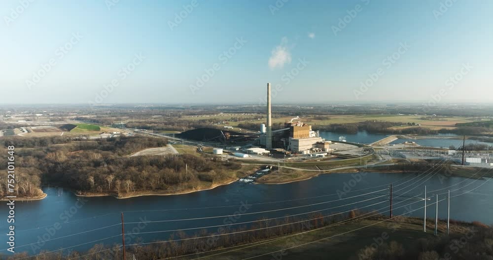 Electrical Power Plant Chimney Emitting Smoke On Shore Of Lake Flint Creek In Arkansas, USA. aerial shot