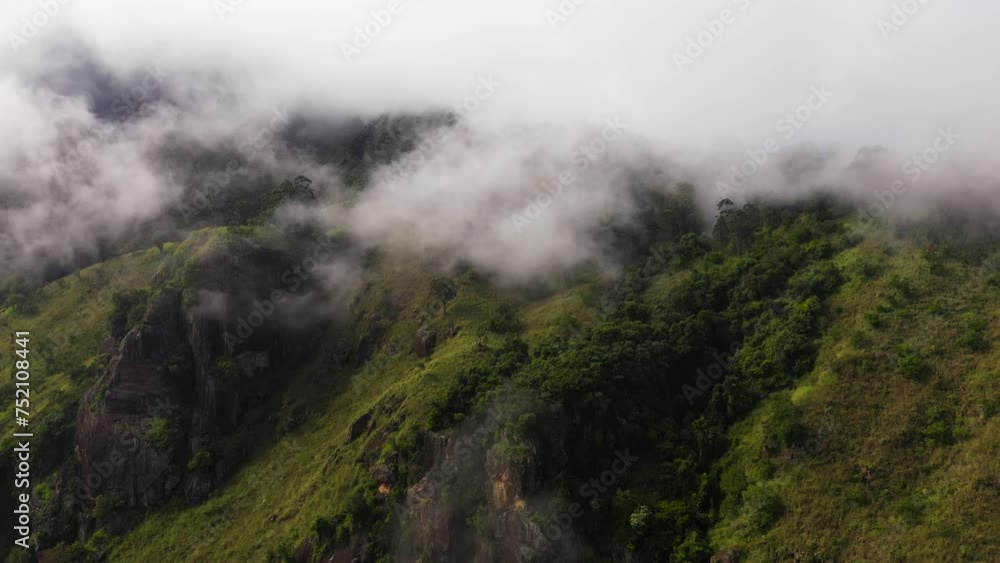 Aerial drone of jungle and mountains covered with clouds. Sri Lanka