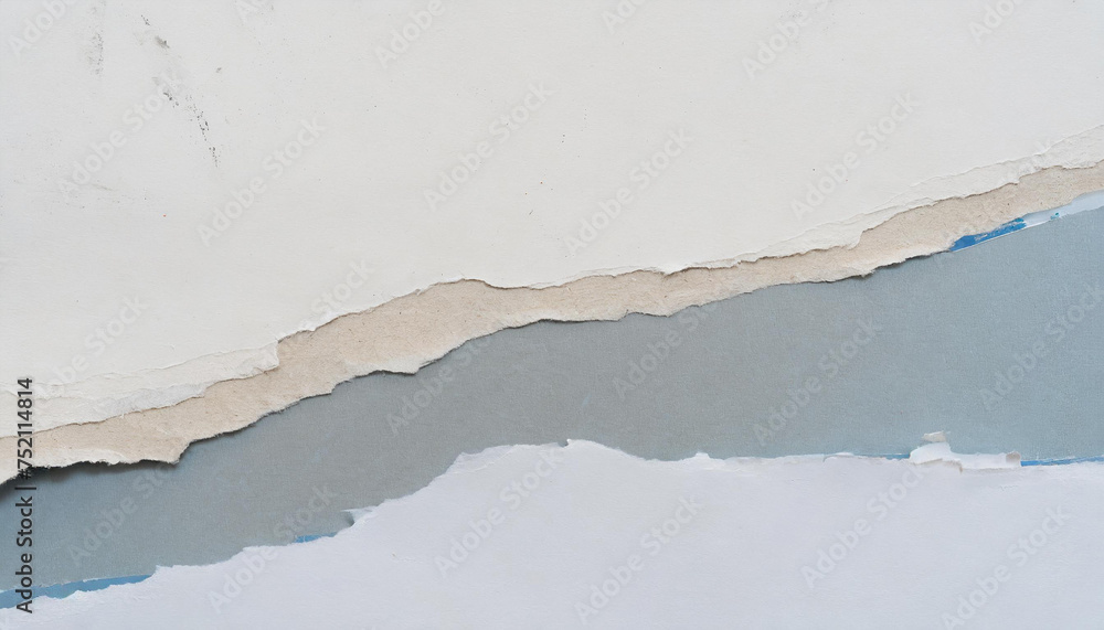 Torn paper layers revealing different shades of blue and beige, creating a textured abstract background. Torn paper layers revealing different shades of blue and beige, creating a textured abstract background.