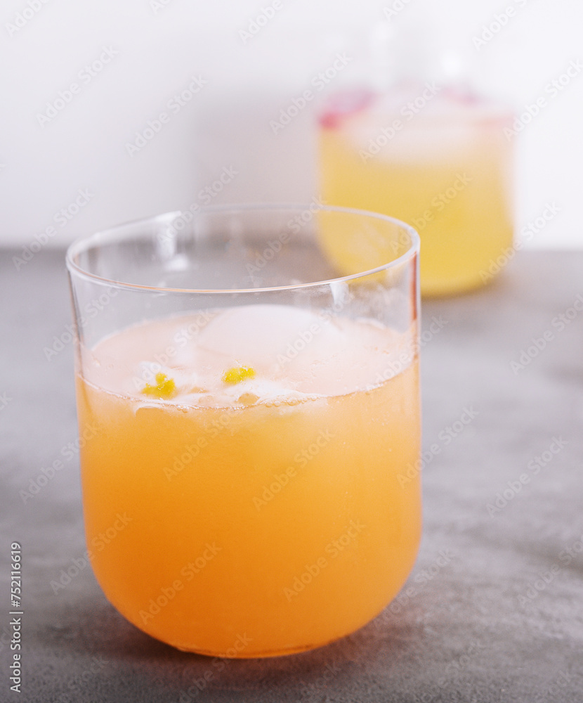 Glasses of orange juice with ice cubes