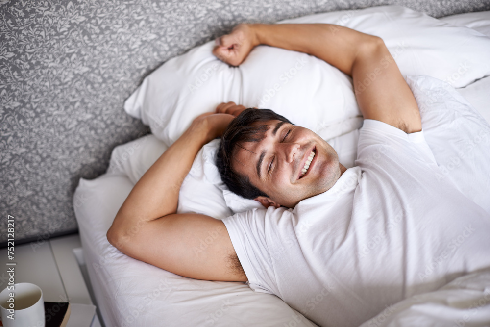 Man, sleep and bed for stretch, wellness and happy for rest in pajamas and bedroom for home and joyful. Male person, relax and dreaming at house, calm and tired in sleepwear and taking nap and smile Man, sleep and bed for stretch, wellness and happy for rest in pajamas and bedroom for home and joyful. Male person, relax and dreaming at house, calm and tired in sleepwear and taking nap and smile