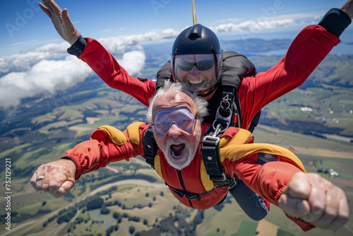 Crazy elderly men skydiving in tandem from a plane high above a scenic landscape of rolling hills, patchwork fields, and winding rivers, their faces filled with exhilaration and joy