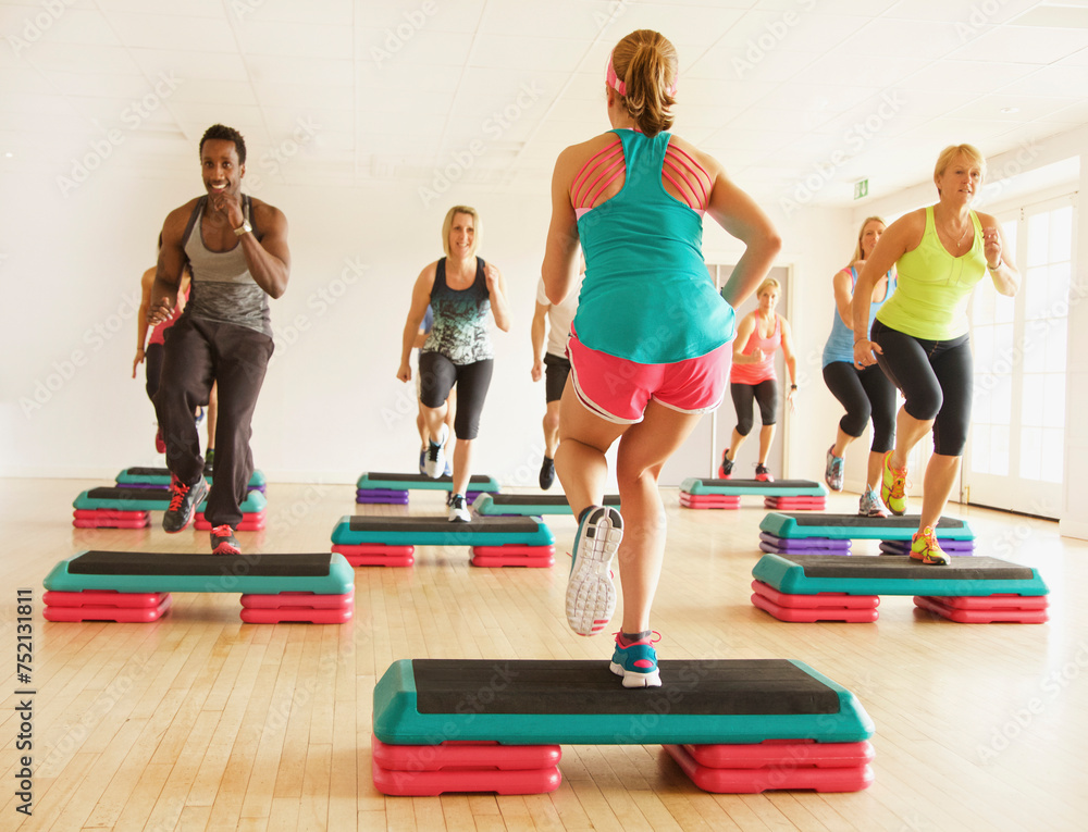 Group of People at Step Aerobics Class
Group of People at Step Aerobics Class