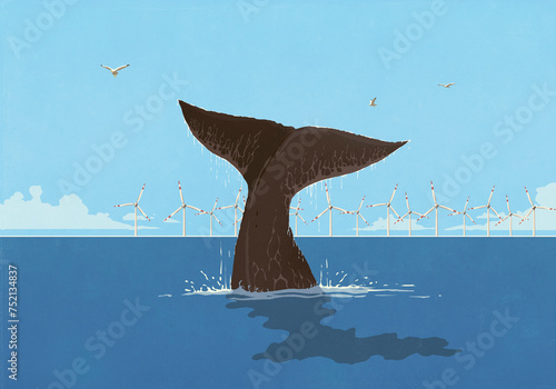 Whale fluke splashing above ocean surface with wind turbines in background
 photo