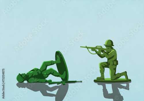 Toy soldier shooting toppled opponent on blue background
 photo