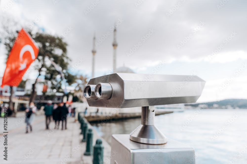 Fototapeta premium Coin Operated Binocular viewer next to the waterside promenade in Istanbul looking out to the Bay and city.