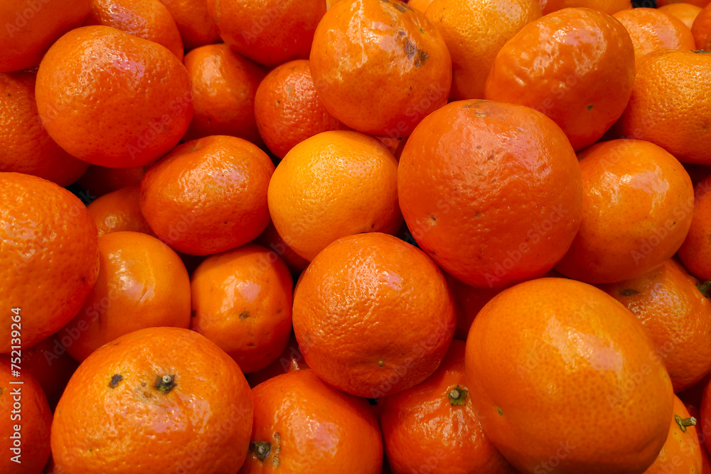 Stack of mandarin oranges on a market stall Stack of mandarin oranges on a market stall