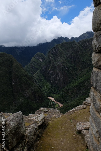 Magic view on the mountain river in the Andes mountains from ruins of lost Inca city Machu Picchu, Peru