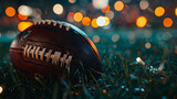 Closeup of an American football ball on the grass of
