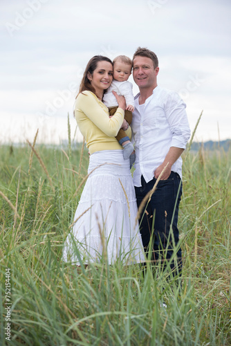 Young family In Sand Dunes.