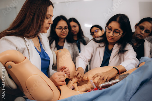 the process of training gynecology students in giving birth on a special mannequin photo