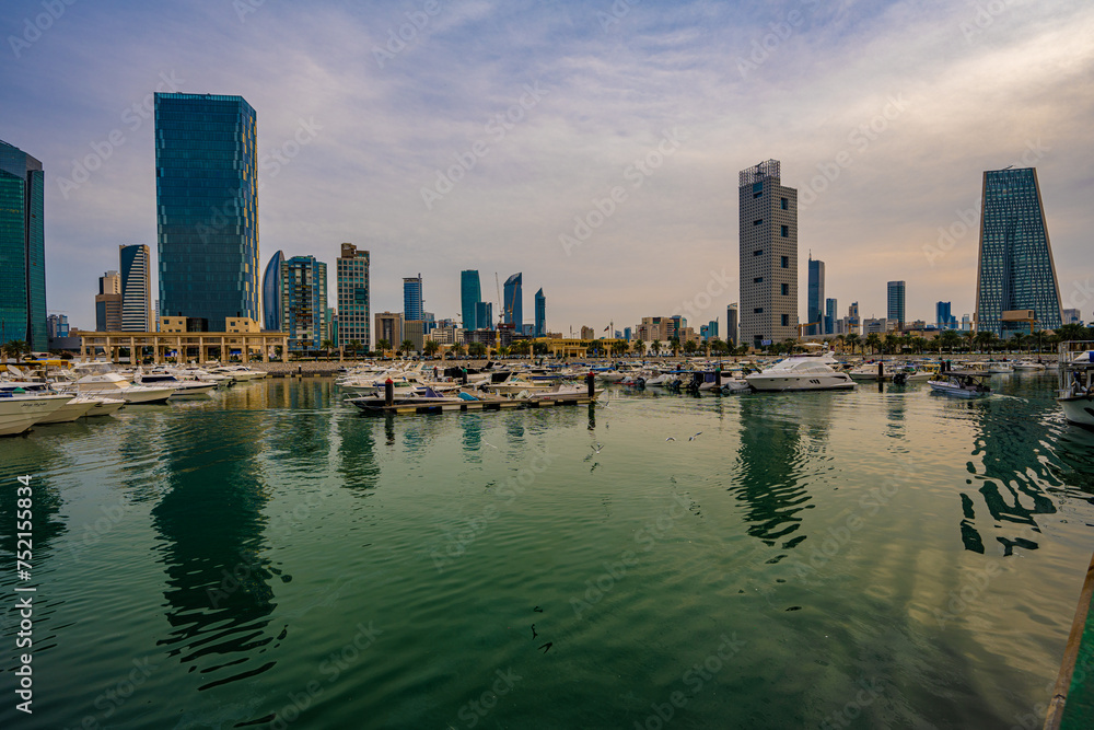 Obraz premium Harbor Life at Souq Sharq Marina with Kuwait City Skyline