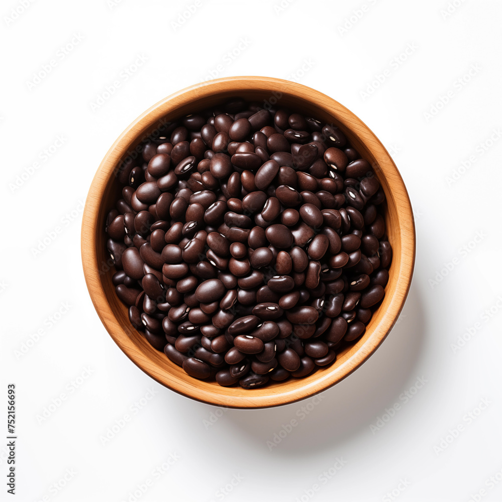 Raw black beans in wooden bowl isolated on white Raw black beans in wooden bowl isolated on white