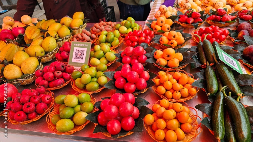 Assorted fruits and vegetables in baskets at a vibrant market, Shilin Stone Forest, China