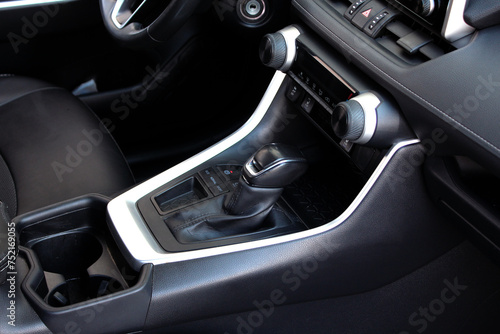Automatic gear shifter. New SUV gear stick. Automatic gearbox. Car detailing. Automatic transmission lever shift. Moder car interior. © Best Auto Photo